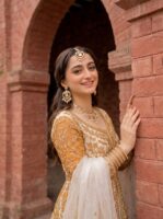 Woman_posing_by_brick_pillar_202608190843